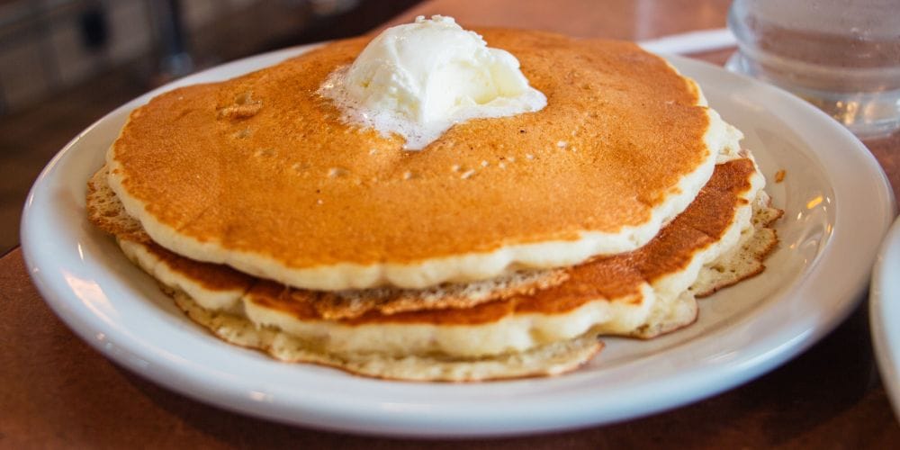Pancakes served on a table.